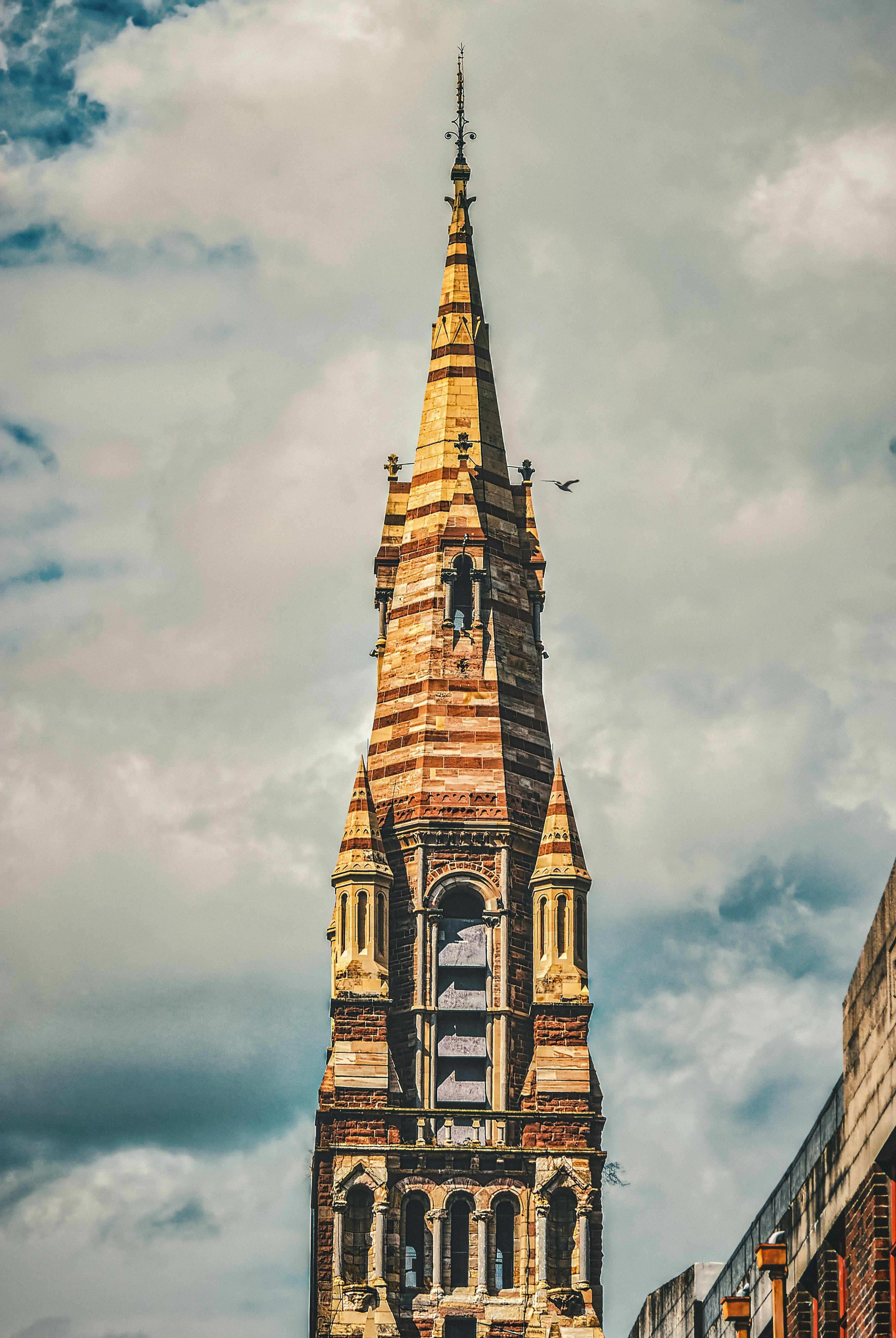 brown concrete building under cloudy sky during daytime